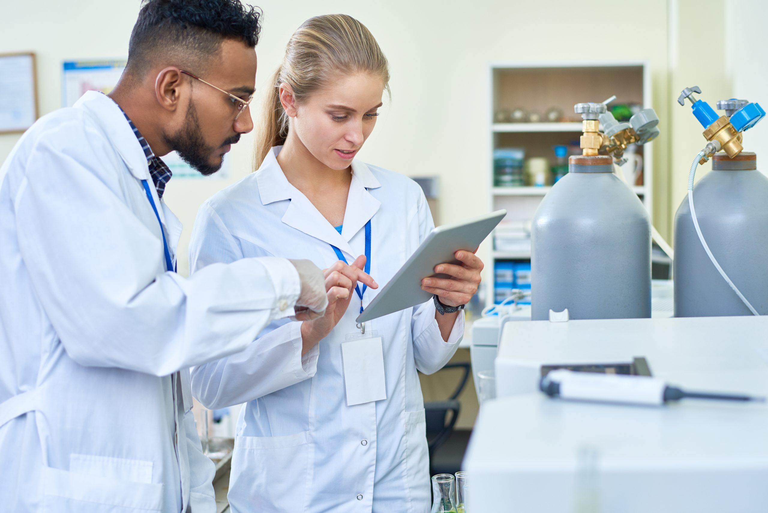 laboratory-employees-working-as-team-2021-09-24-04-02-25-utc (1)